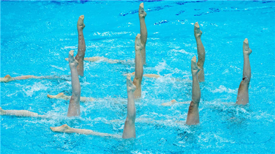 “Water Ballet: Flowers Swim and Dance in Synchronized Swimming Championship”